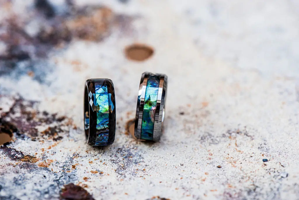 Two Bespoke Rings with Crushed Gemstone Inlays on Rustic Backdrop