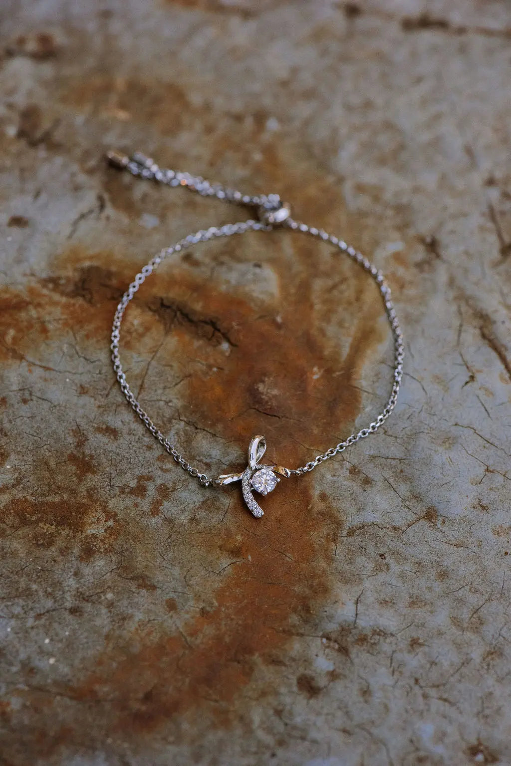 Sterling Silver Bracelet with Bow Shaped Pendant and round cut Moissanite Stone