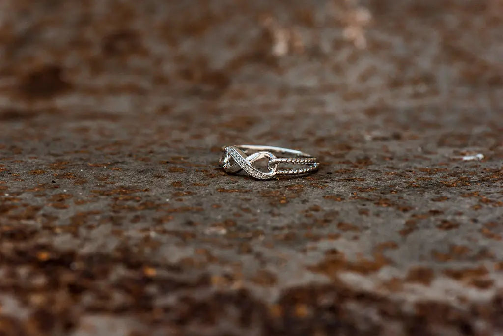 Ladies Silver Wedding Ring on Rustic Backdrop