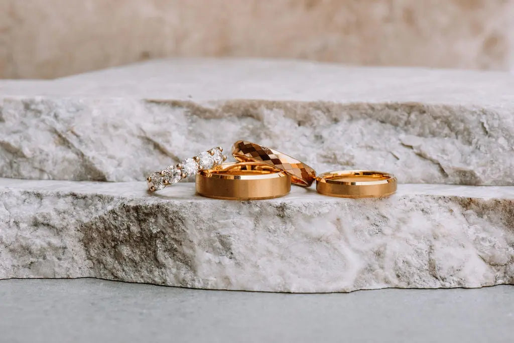 Three Gold Tungsten Carbide Ladies Rings and One Gold Moissanite Ring