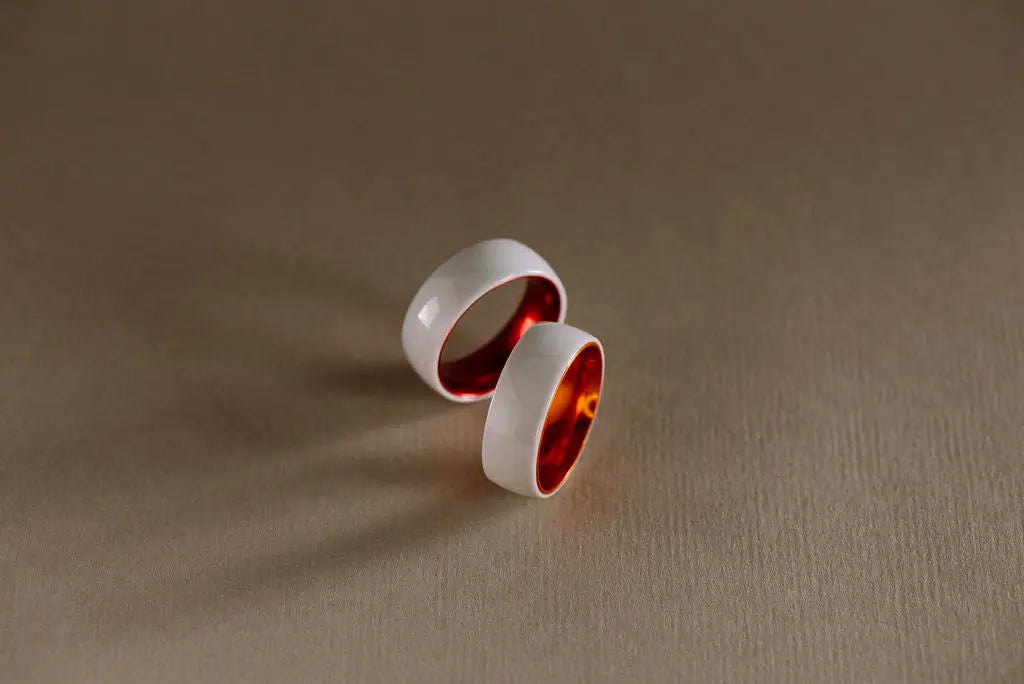 Two Orange and White Ceramic Rings