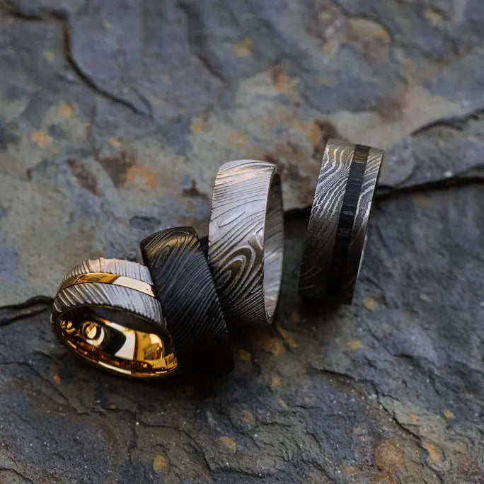 four mens damascus steel rings
