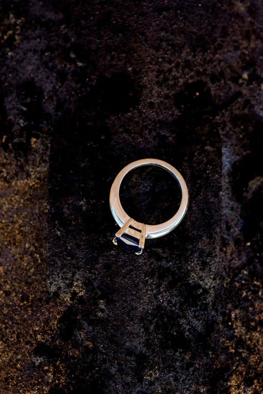 Silver Diamond Size Ring Laying Flat on Rustic Backdrop