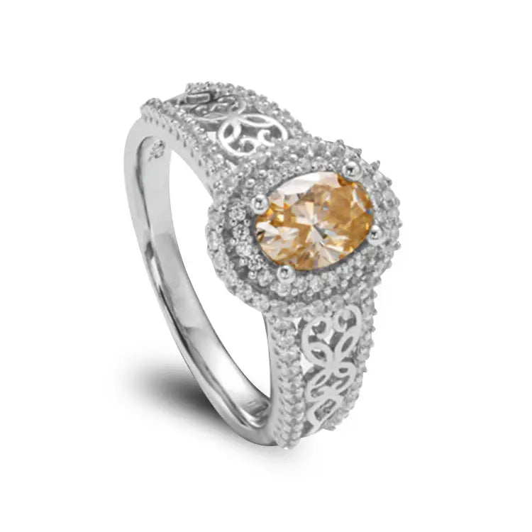 Sterling Silver Ring With Oval Cut Champagne Moissanite and Intricate Pattern Design on Band