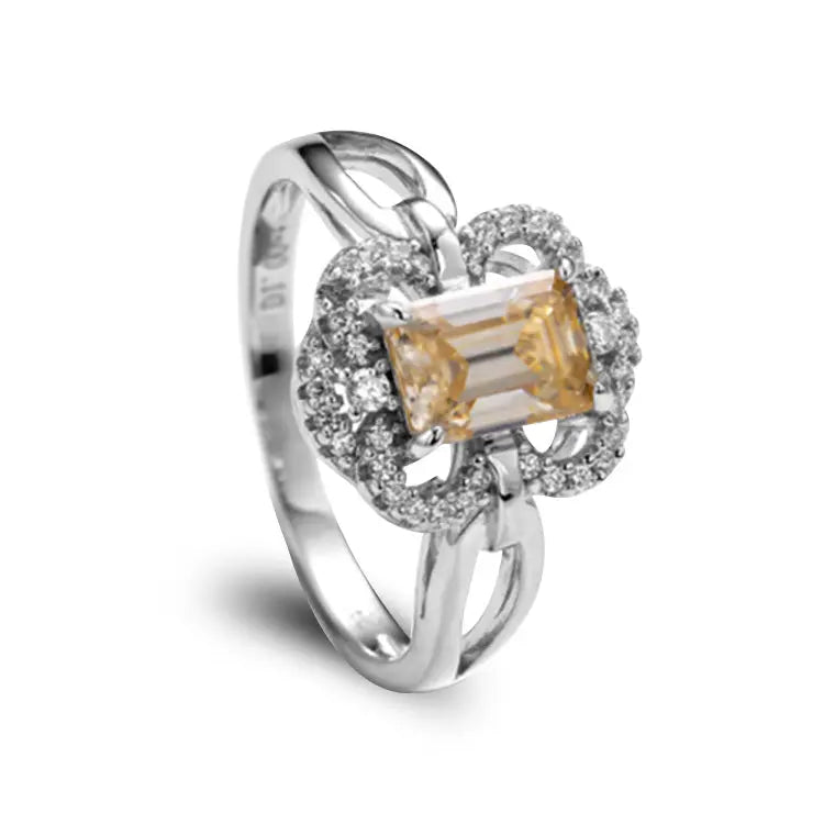 Sterling Silver Ring With Emerald Cut Champagne Moissanite And Wings Design on Band
