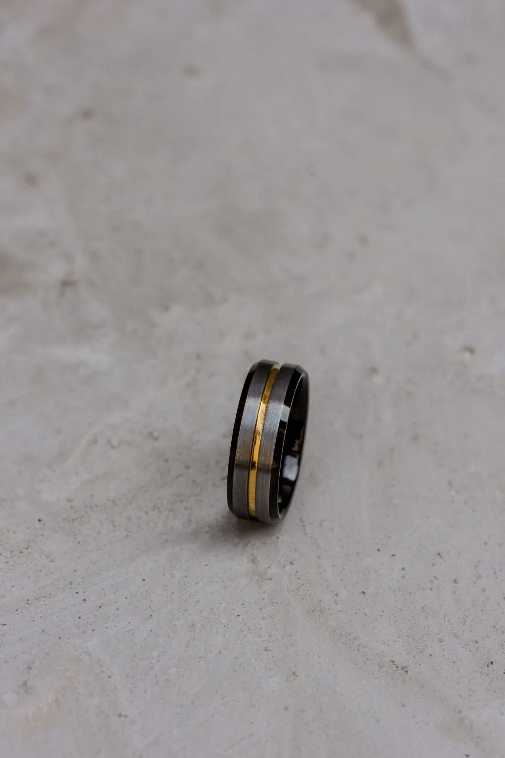 Tungsten Carbide Men's Wedding Ring with Gold Inlay on Light Backdrop