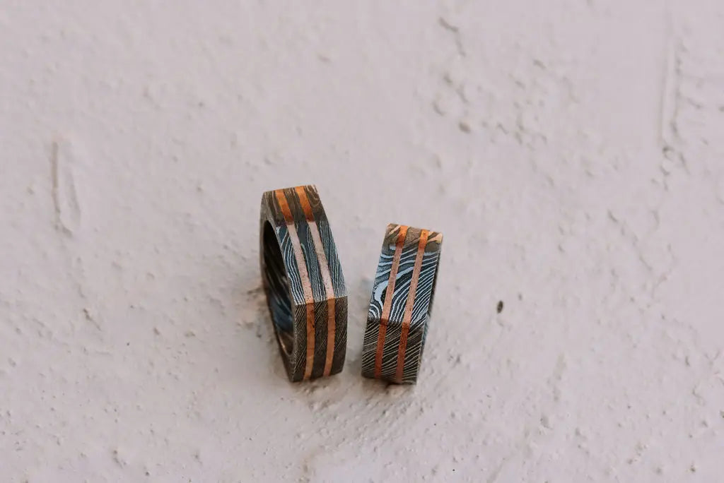 Two Square Damascus Steel Rings with Bronze Inlays