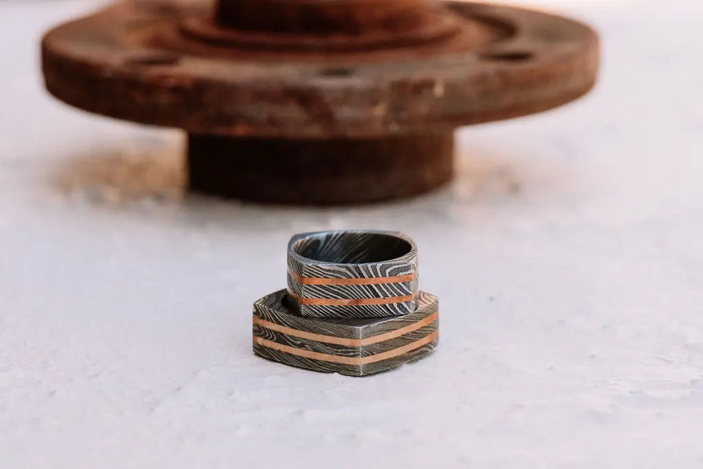 Two Square Damascus Steel Rings With Bronze Inlays