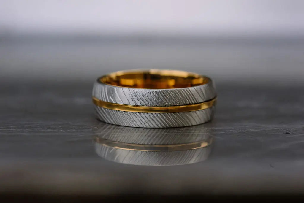 gold tungsten ring with silver damascus steel outer