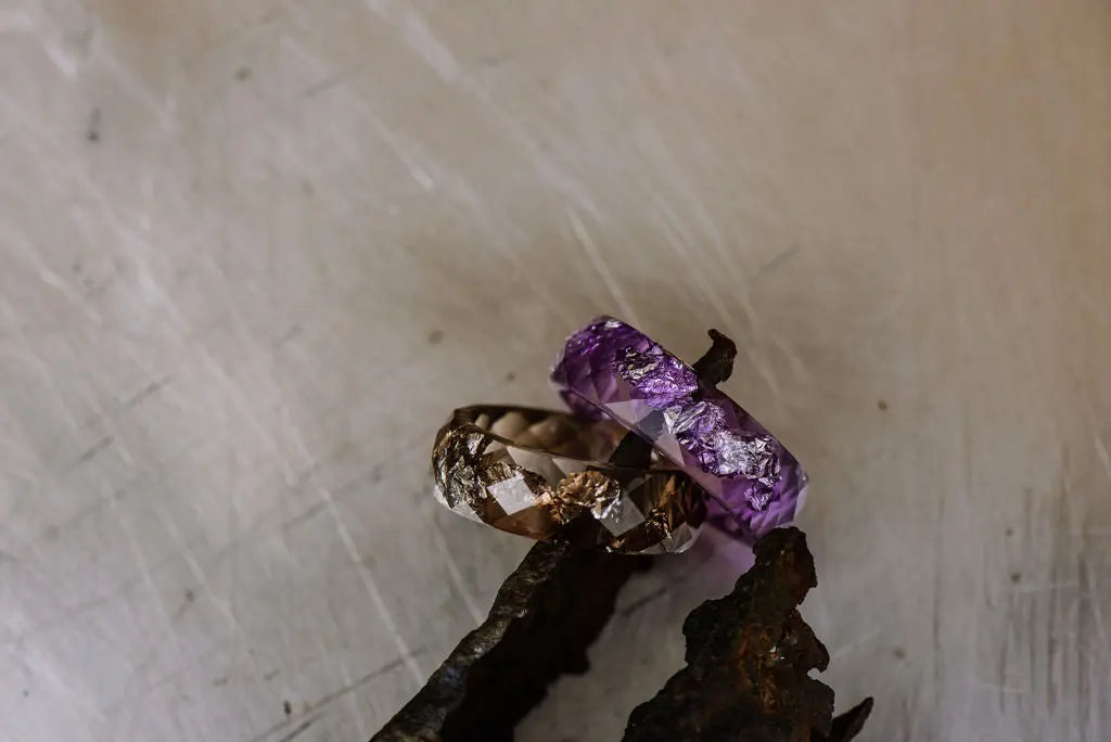purple and brown resin rings on stone background