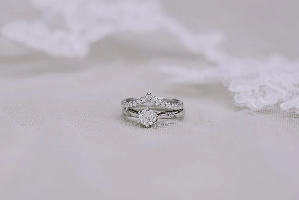 two sterling silver moissanite rings
