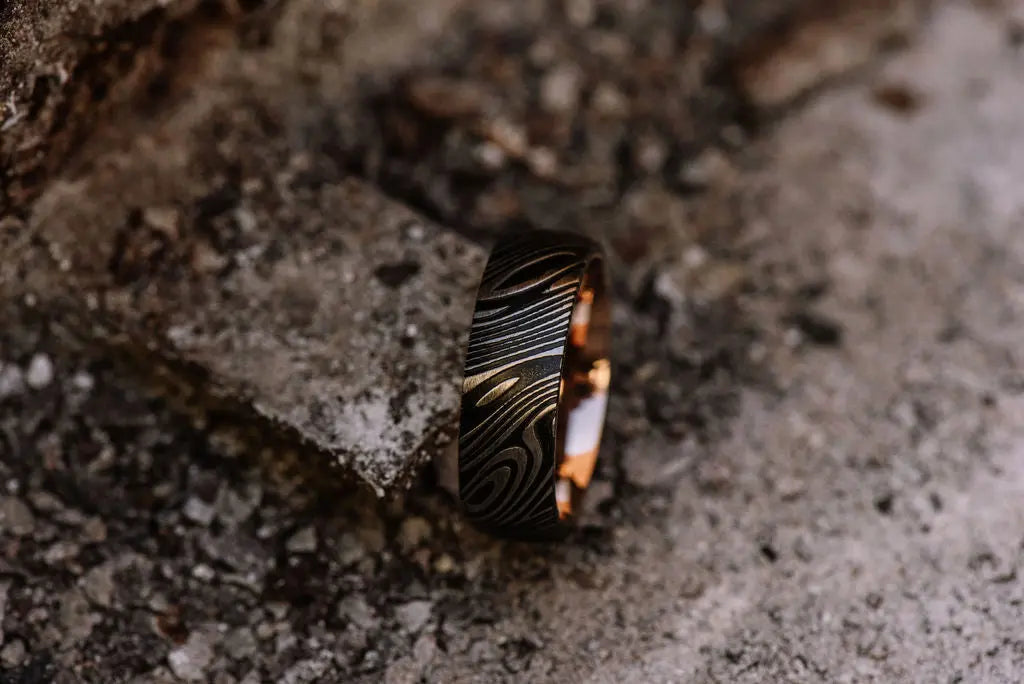 Black Damascus Steel Ring With Rose Gold Inner