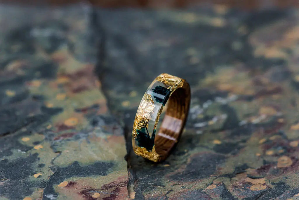 Transparent Resin Ring with Gold Foil Inlay on Rustic Backdrop