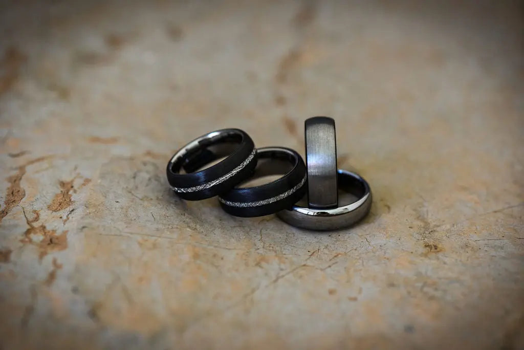 Four Titanium Rings Laying on one another