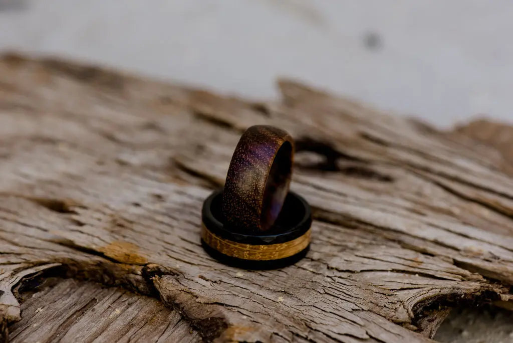 Two Wood Rings On Old Wooden Backdrop
