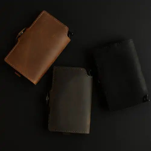 Group of three leather wallets