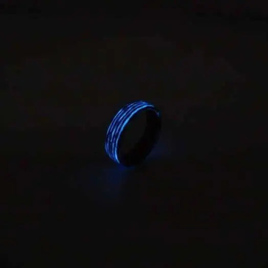 Glow in the dark ring with wood inner wedding band and carbon fibre ring material