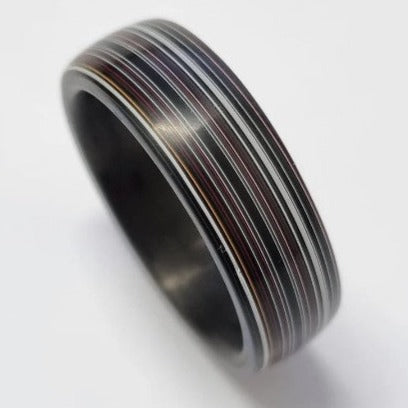 Black Carbon Fibre Ring with Fordite Outer Layer